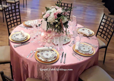 A table set with plates and silverware on top of it.